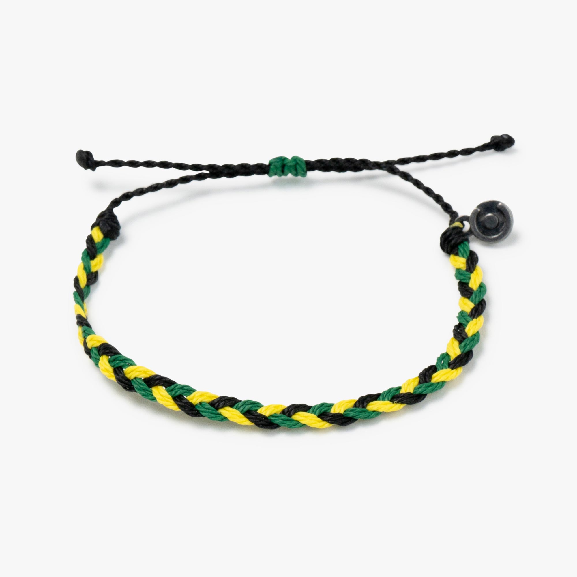 A woven bracelet with black, green, and yellow strands, featuring a gunmetal power pose charm.