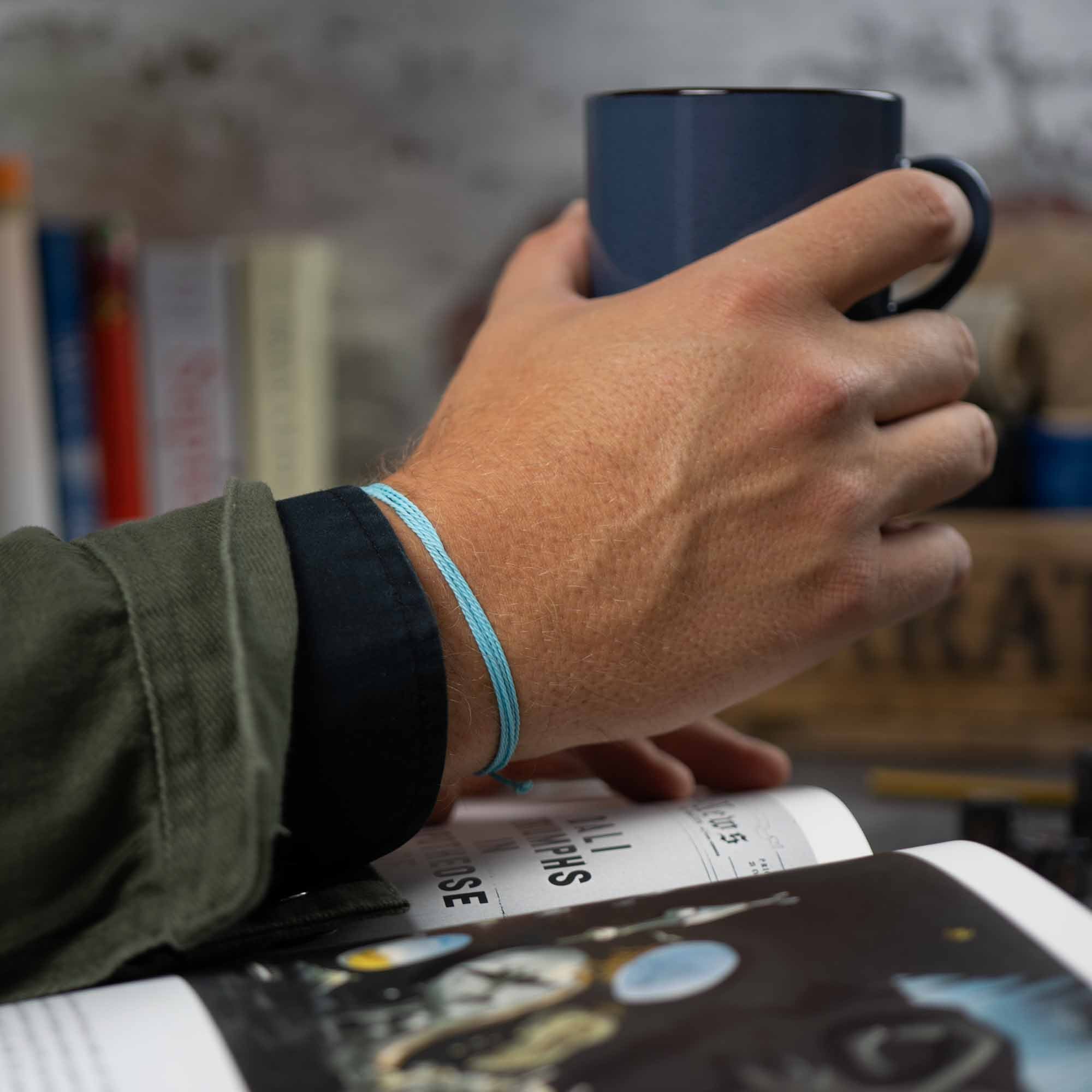light blue string bracelet