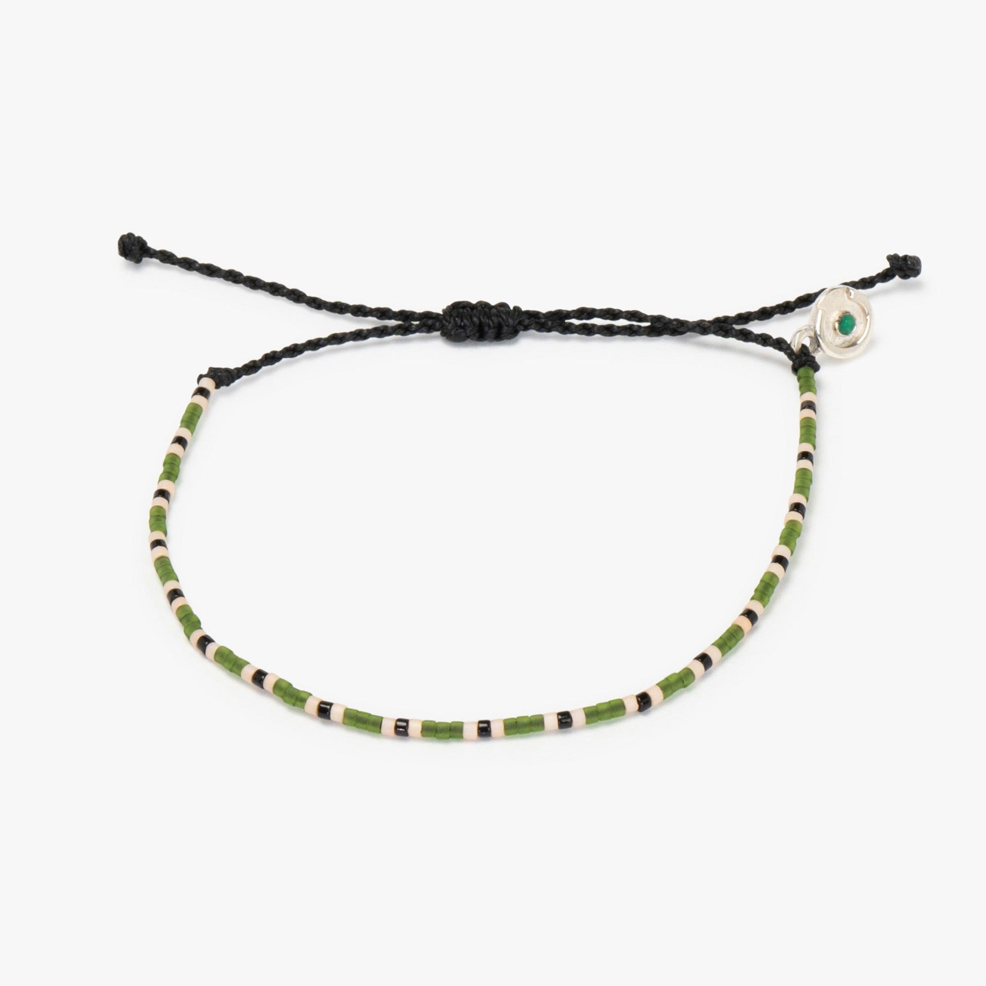Adjustable bracelet with green beads and a silver charm featuring a power pose silver charm, on a white background.