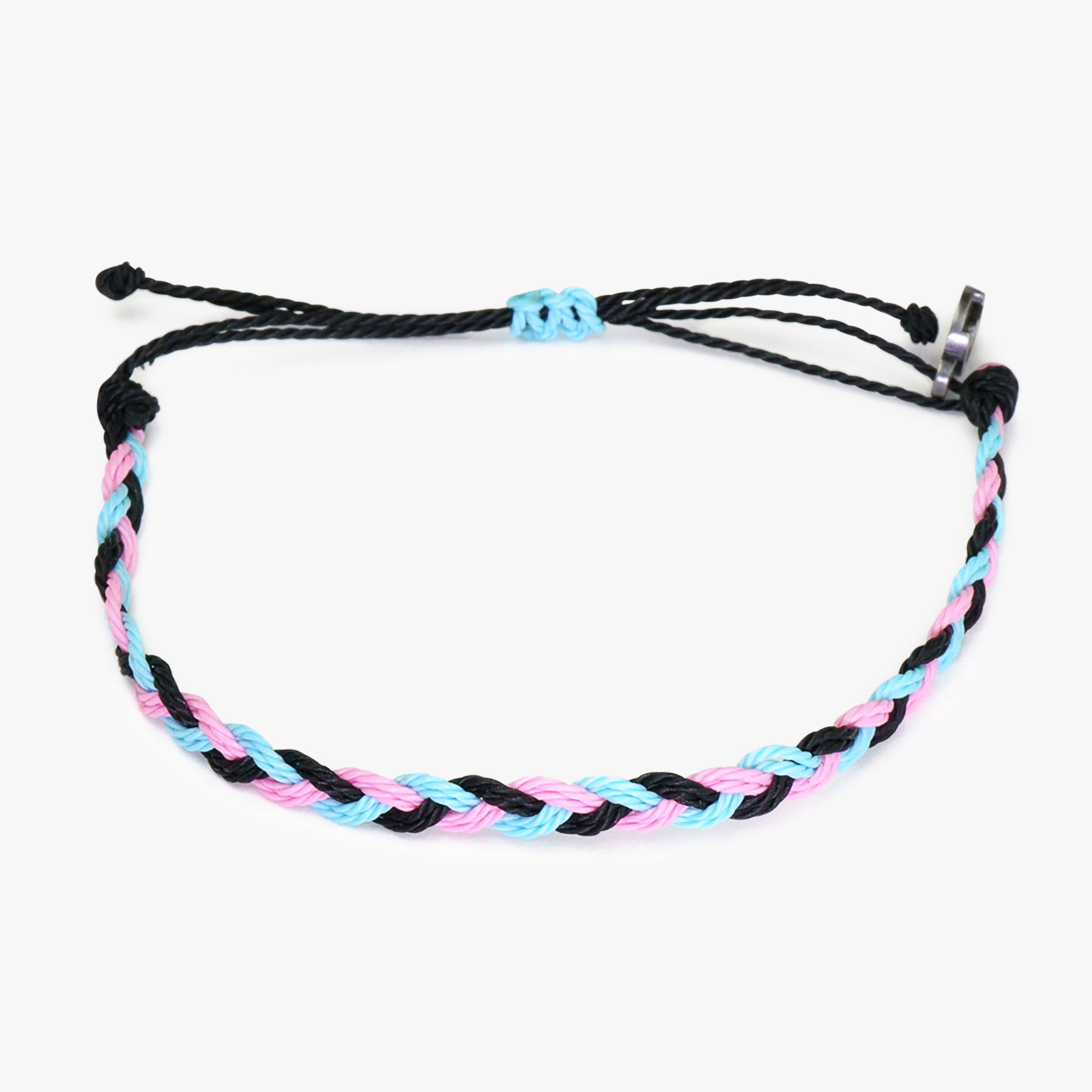 A woven bracelet with black, blue, and pink strands, featuring a gunmetal power pose charm, against a white background.
