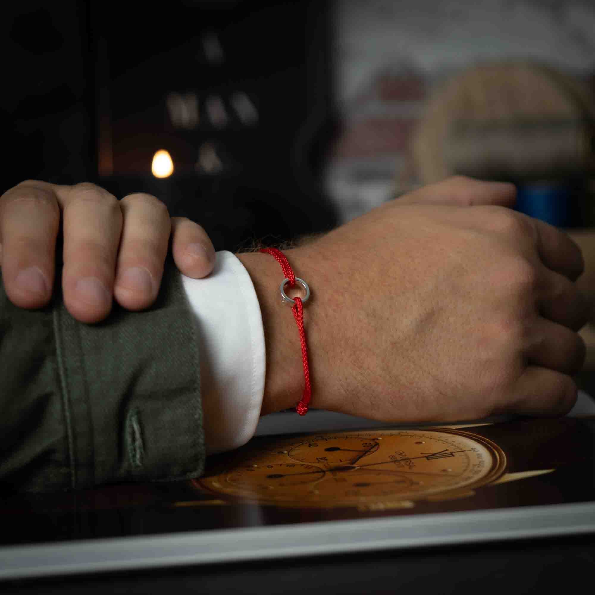 red bracelet with silver ring for men