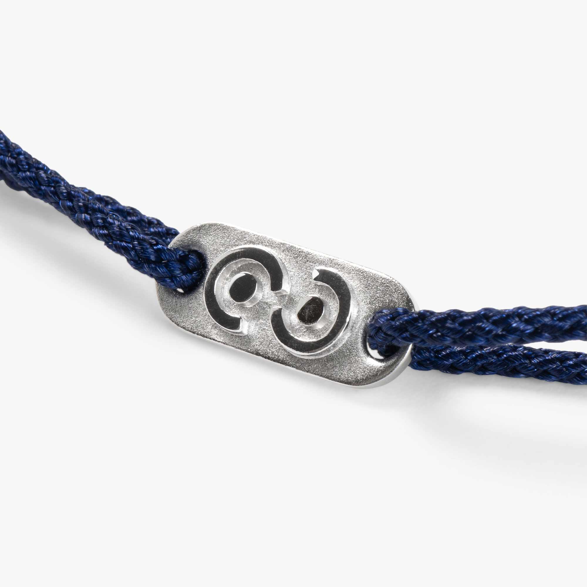 silver tag on blue men's bracelet