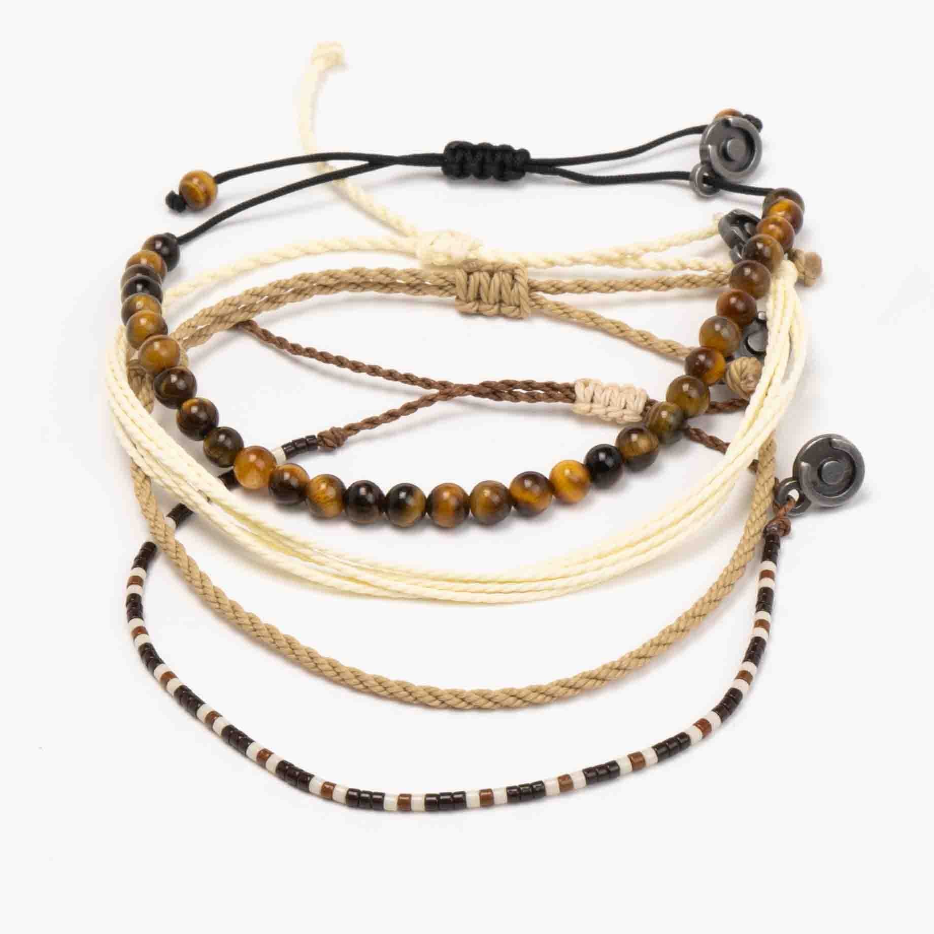 A set of four bracelets with beige, brown, and black colors, including one with tiger eye gemstones and others with beads, designed to be adjustable.