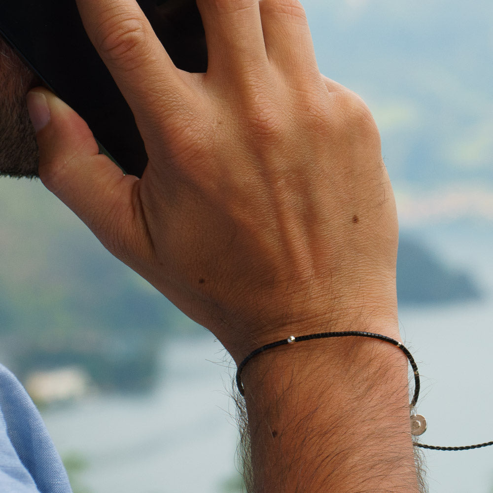 mens beaded bracelet with silver charm