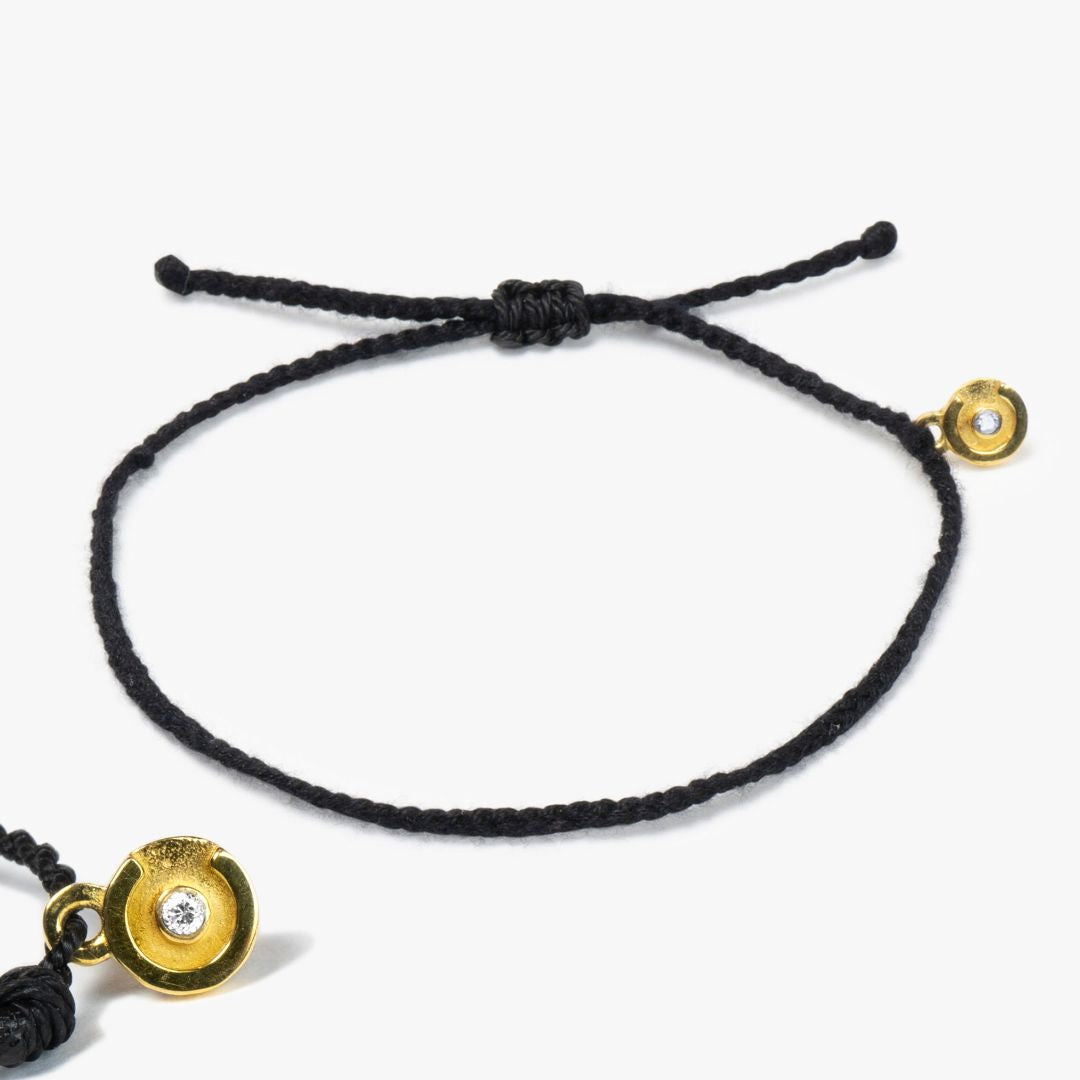 black original bracelet with 14k gold charm