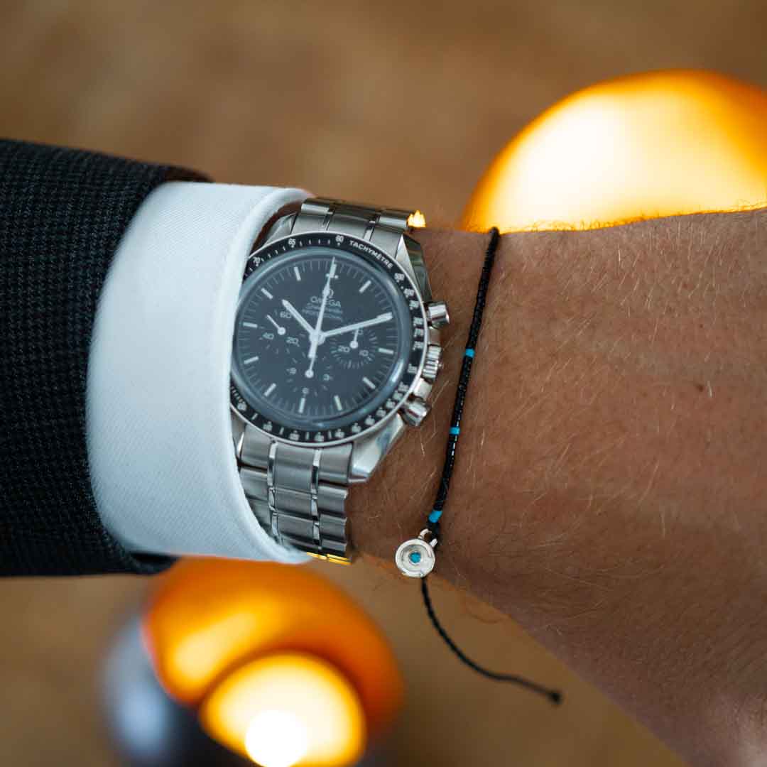 black bracelet with blue topaz stone