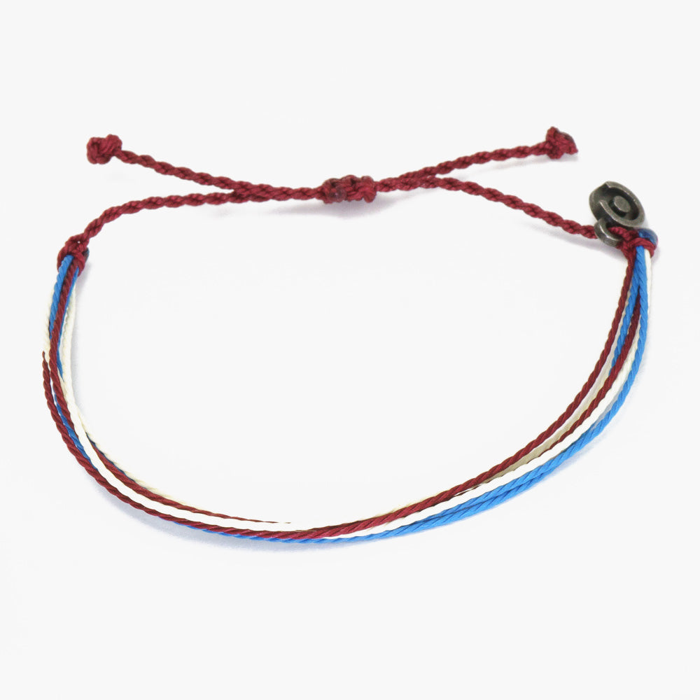 A multicolored wax-coated polyester string bracelet with a Chibuntu charm, tied adjustable.