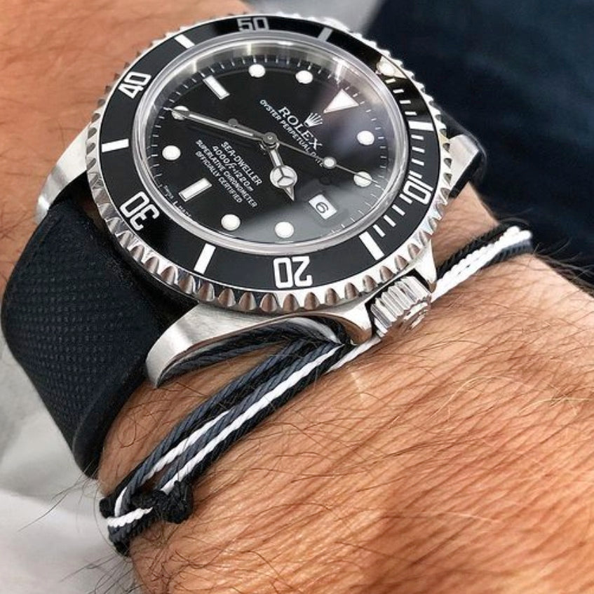 james bond string bracelet next to Rolex Submariner