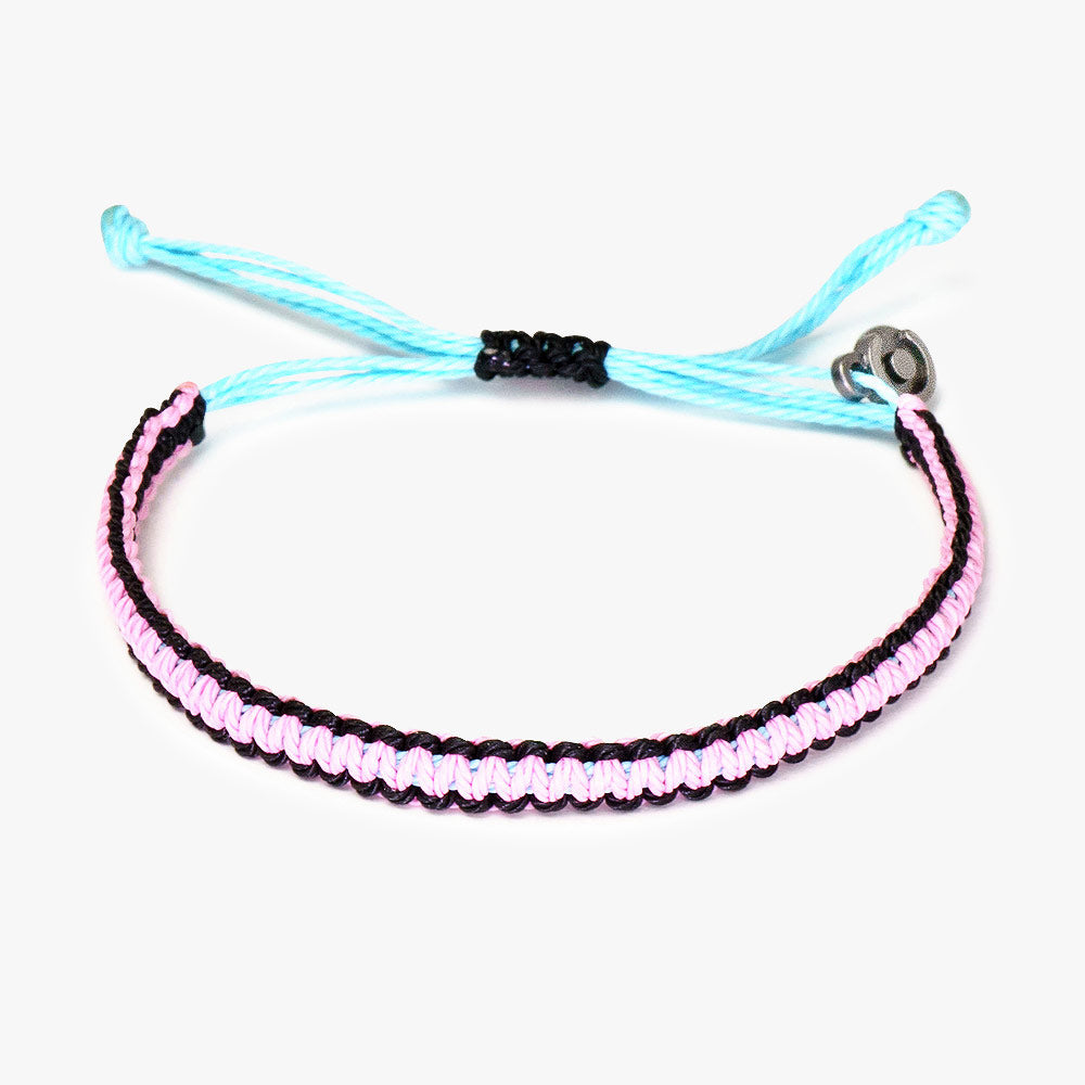 A two-tone men's bracelet with pink and black wax-coated polyester and a Chibuntu power pose charm.