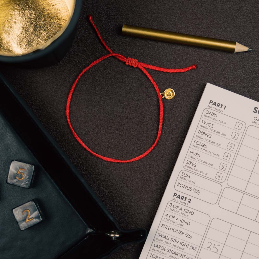 red bracelet with 14k gold charm for men