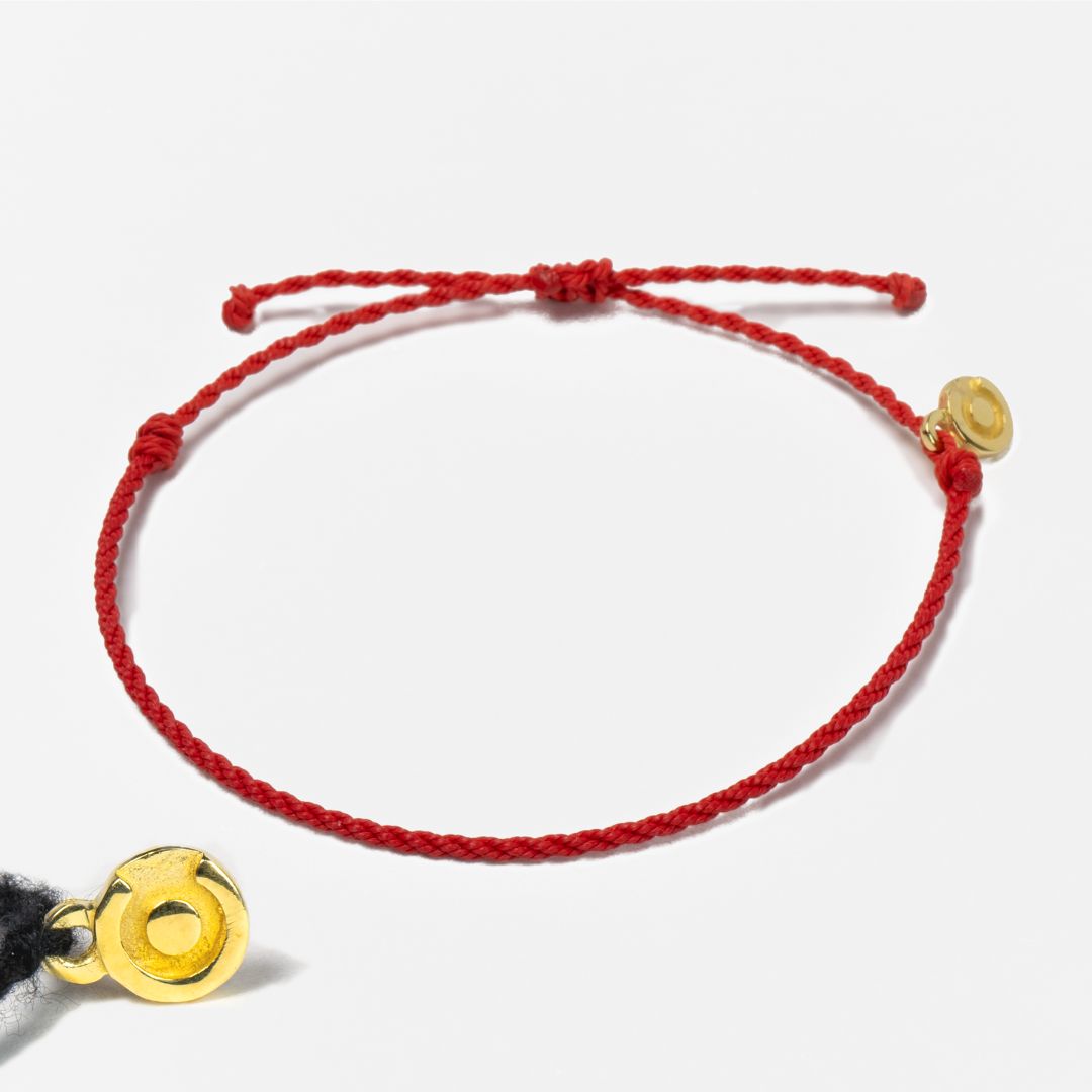 red bracelet with gold charm for men