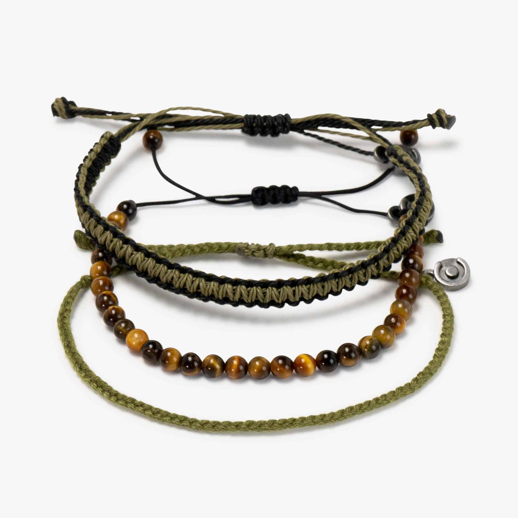A set of three bracelets, featuring a Tiger Eye gemstone bracelet, a waxed-coated polyester Cobra bracelet, and a polyester Original bracelet, in green and black colors with an adjustable fit and a gunmetal charm.