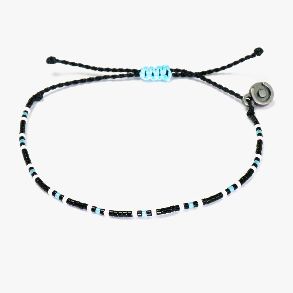 blue & black men's beaded bracelet on white background.