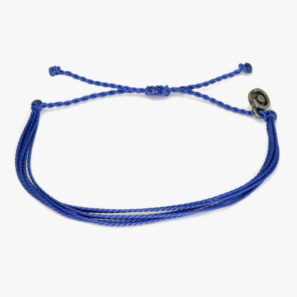 A navy blue string bracelet with a gunmetal charm, displayed against a white background.